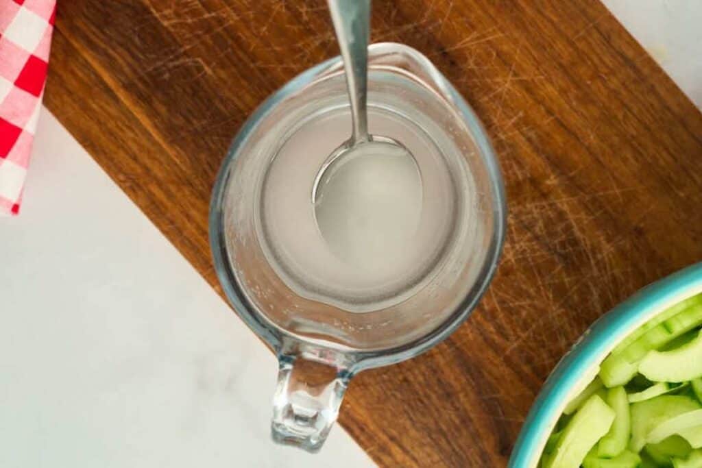 pyrex cup filled with vinegar and sugar