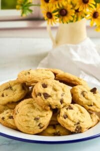 plate of cookies with flowers in background