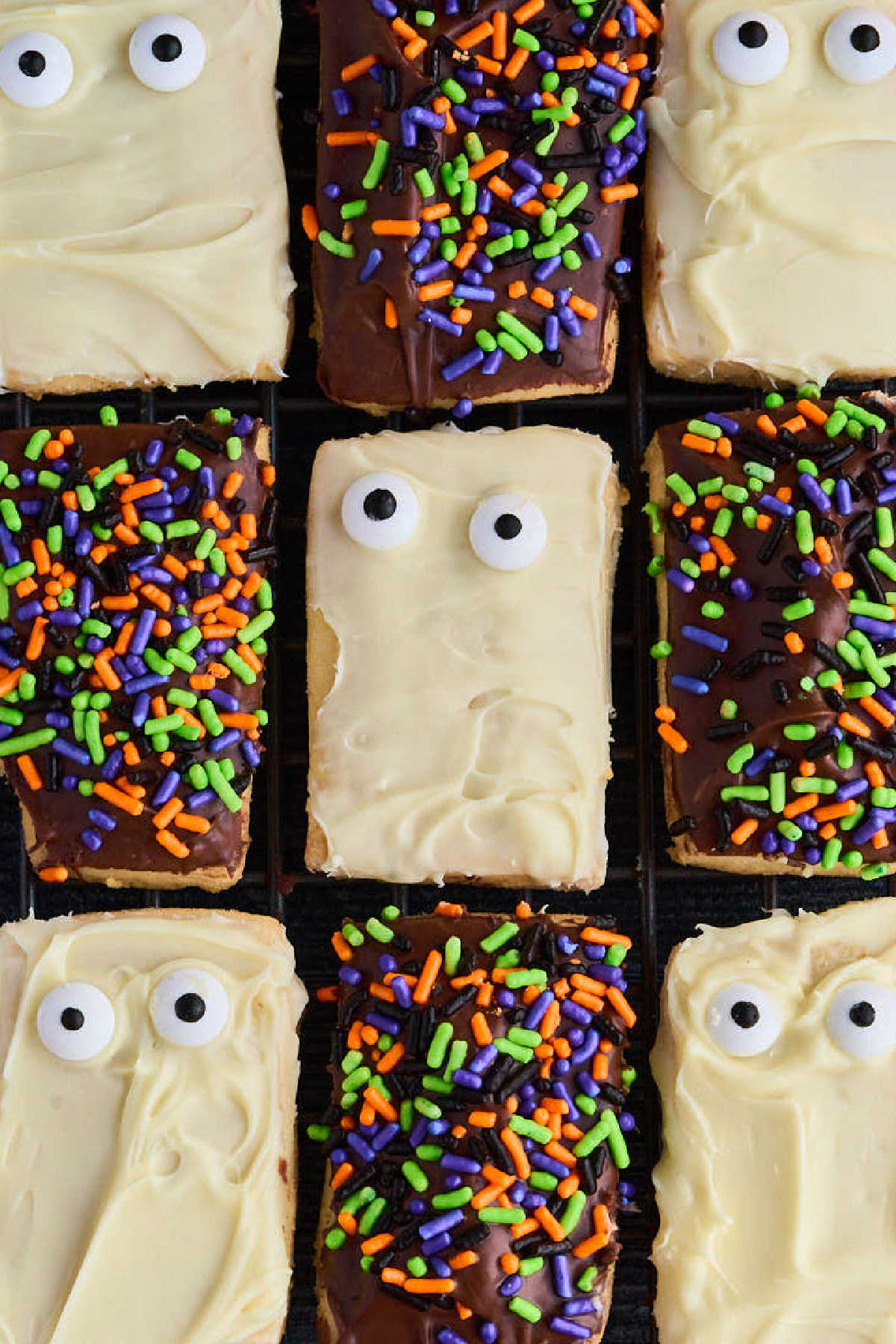 finished cookies with ghosts and sprinkles
