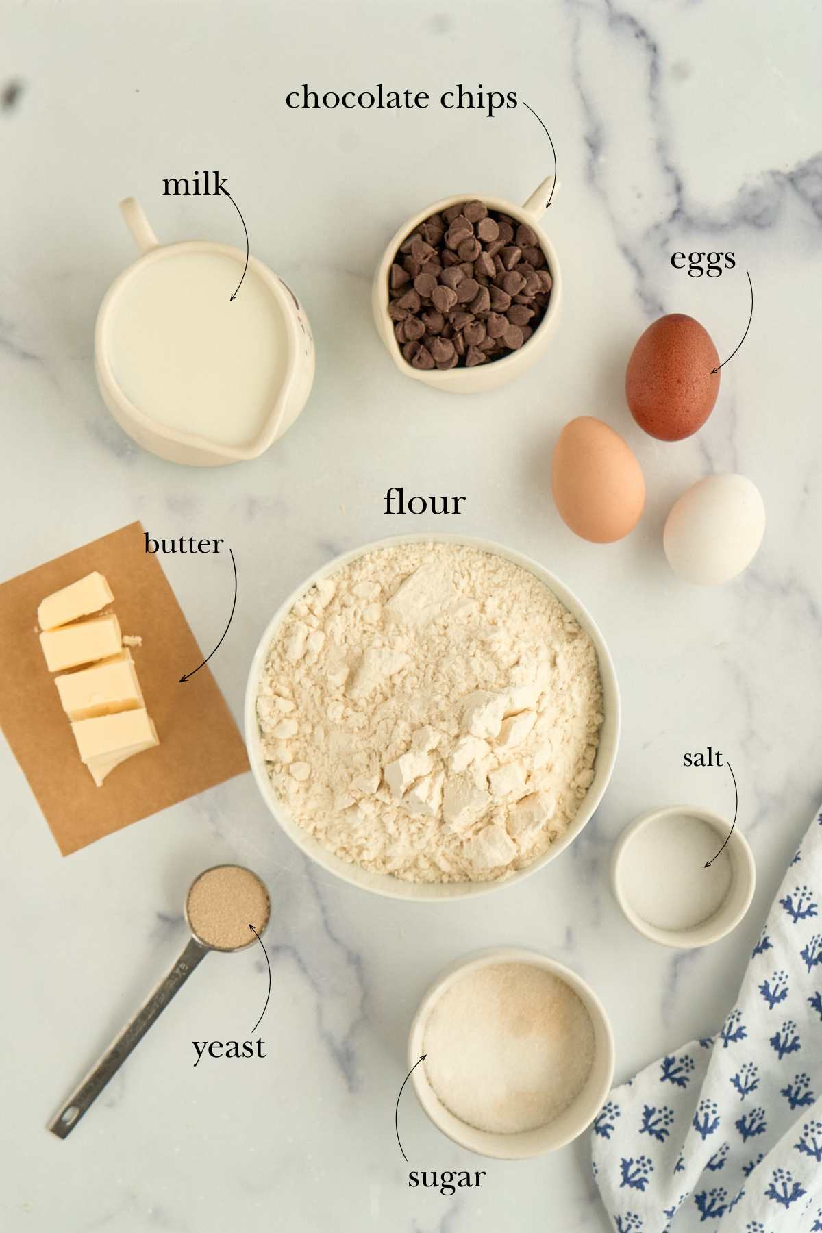 ingredients for brioche laid out on marble counter.