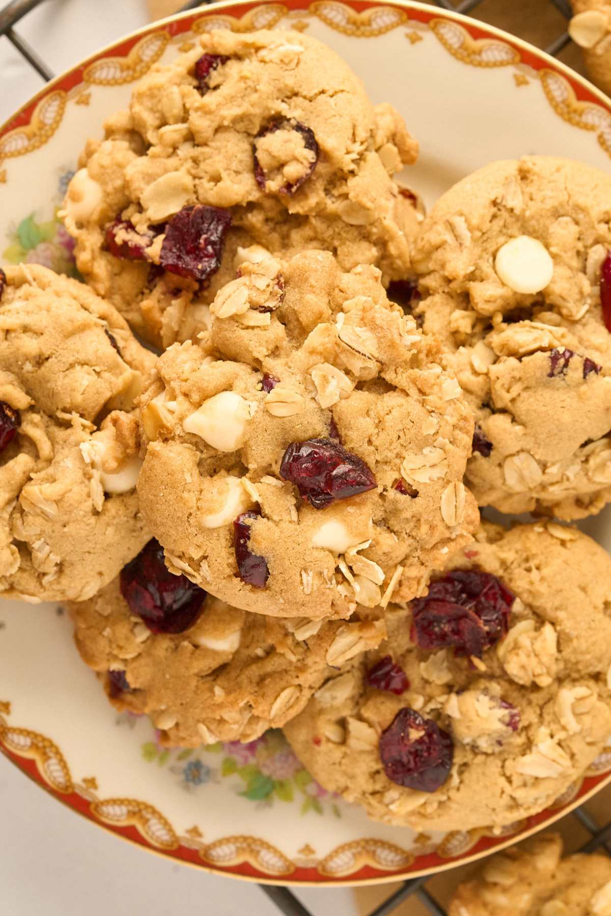 close up view white chocolate and cranberry cookies with oats.