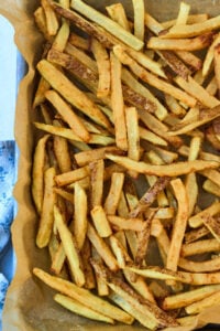 tray of french fries of piece of parchment.