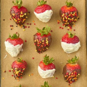 parchment paper with chocolate covered strawberries on top