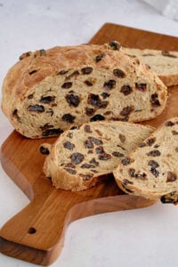 finished loaf on wooden board.