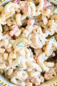 close up of macaroni salad with small shrimp.