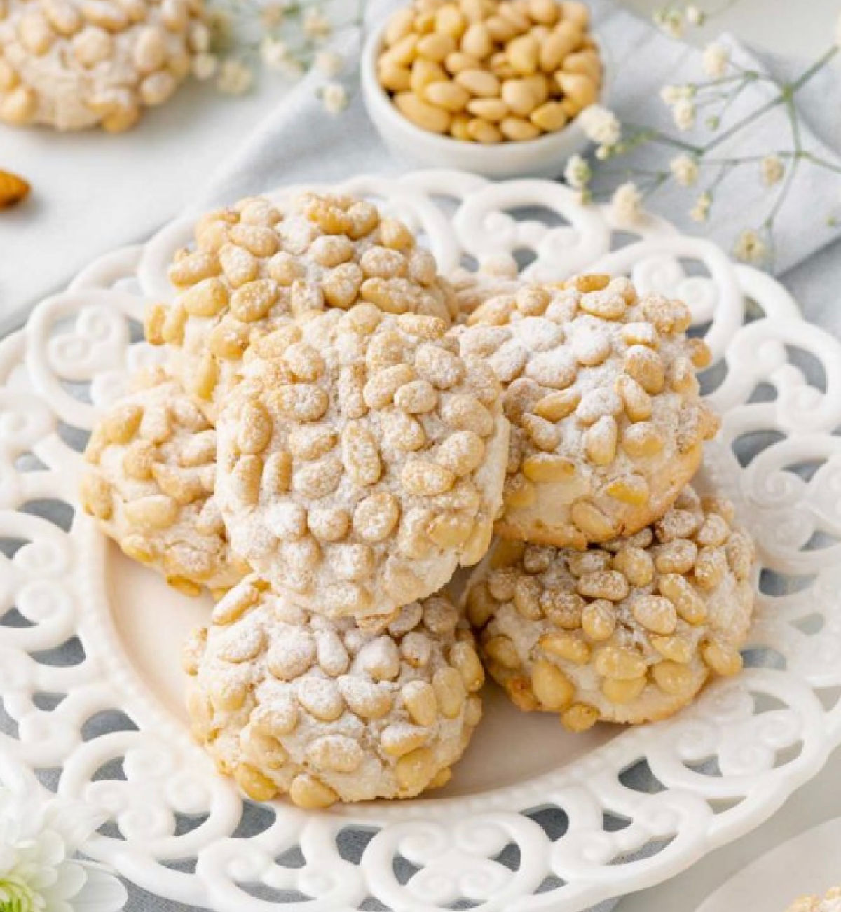round soft cookies with pine nuts.