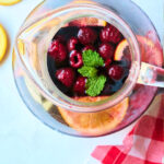 overhead view of pitcher with mint and berries.
