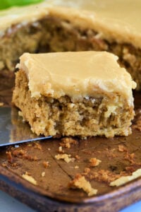 baking sheet with cake being lifted up.