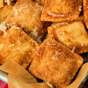 close up view of breaded and fried ravioli.