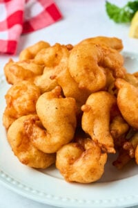 plate of finished fried battered shrimp.