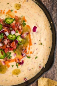 close of view of queso dip in skillet.