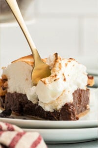 slice of layered chocolate pie with fork.