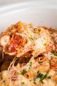 slow cooker baked ziti being served.