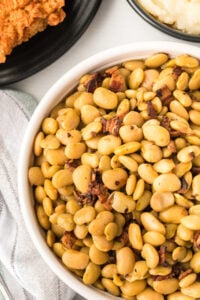 serving bowl of butterbeans with bacon.