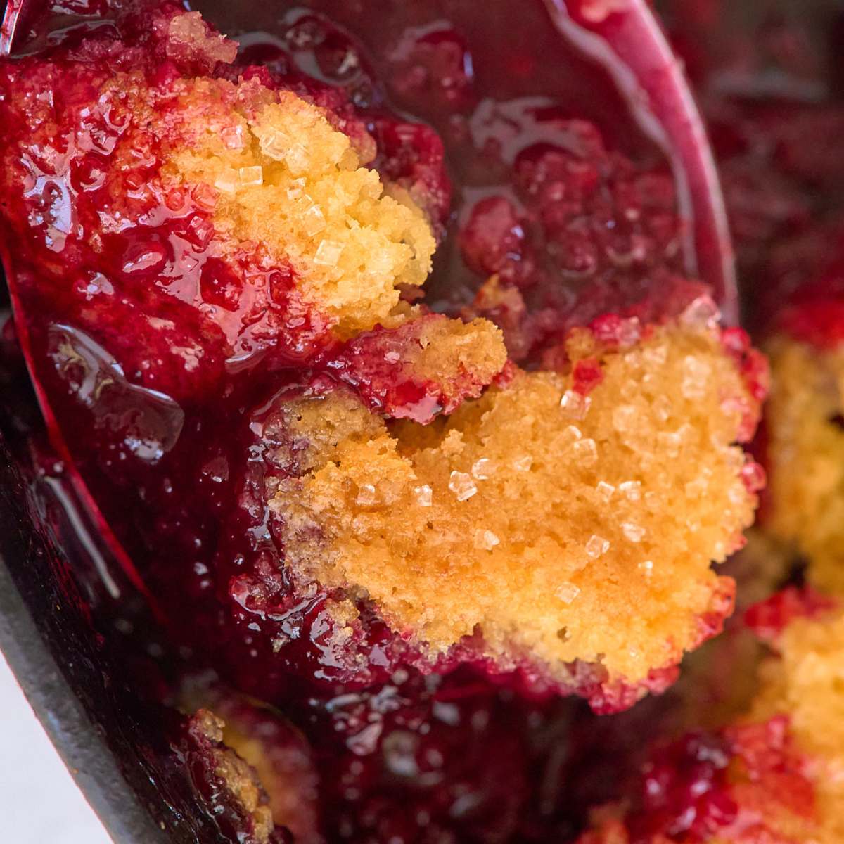 close up view of scoop of cobbler.