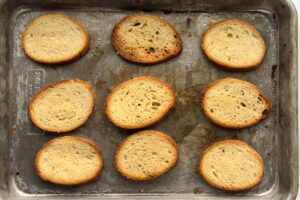 finished crostini on baking sheet.
