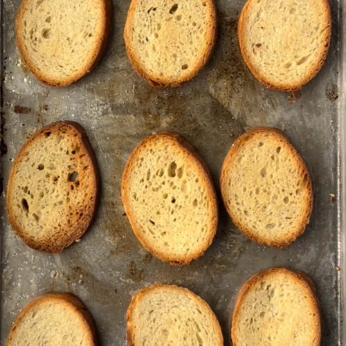 tray of finished brownned crostini.