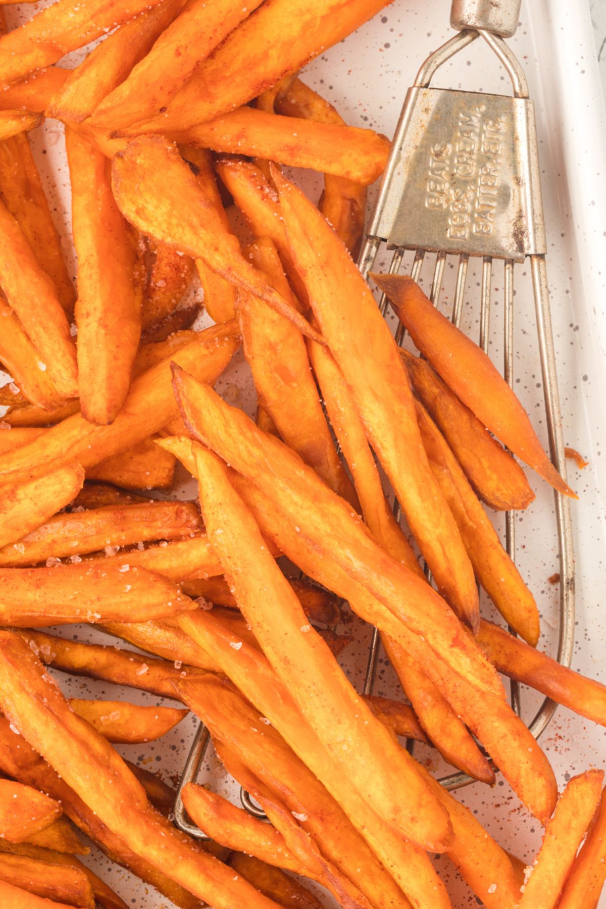 sweet potato fries on baking sheet.