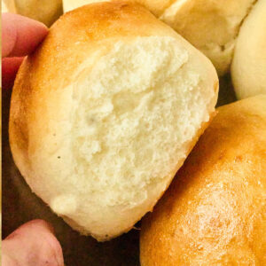 potato roll being picked up.