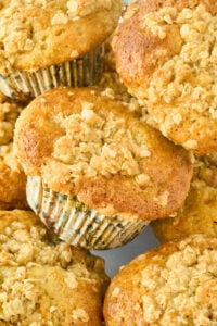stack of sourdough banana muffins with crumb topping.