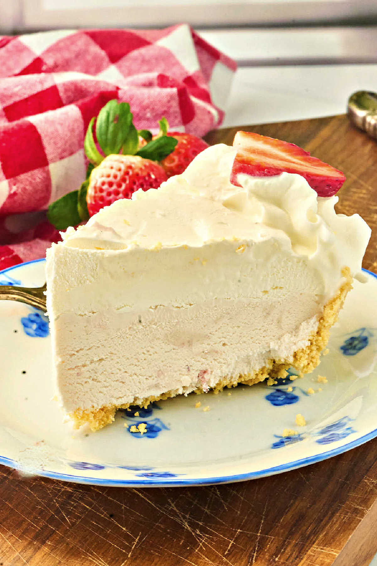 cut slice of strawberry ice cream pie.