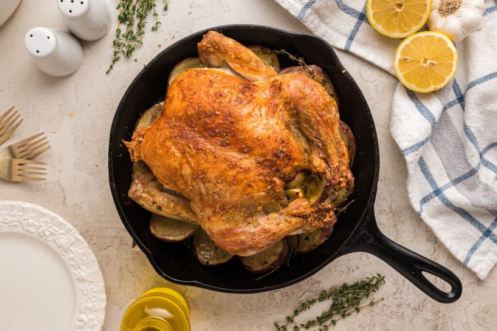 finished roast chicken in skillet.