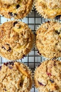 6 jumbo blueberry muffins on wire cooling rack.