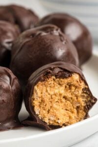 peanut butter balls with rice krispies on plate.