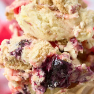 close up of homemade ice cream with blueberry and strawberry swirl.