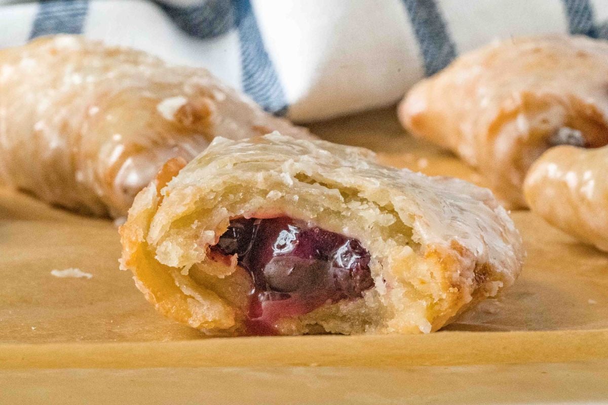 close up of hand pie with bite missing to show filling.