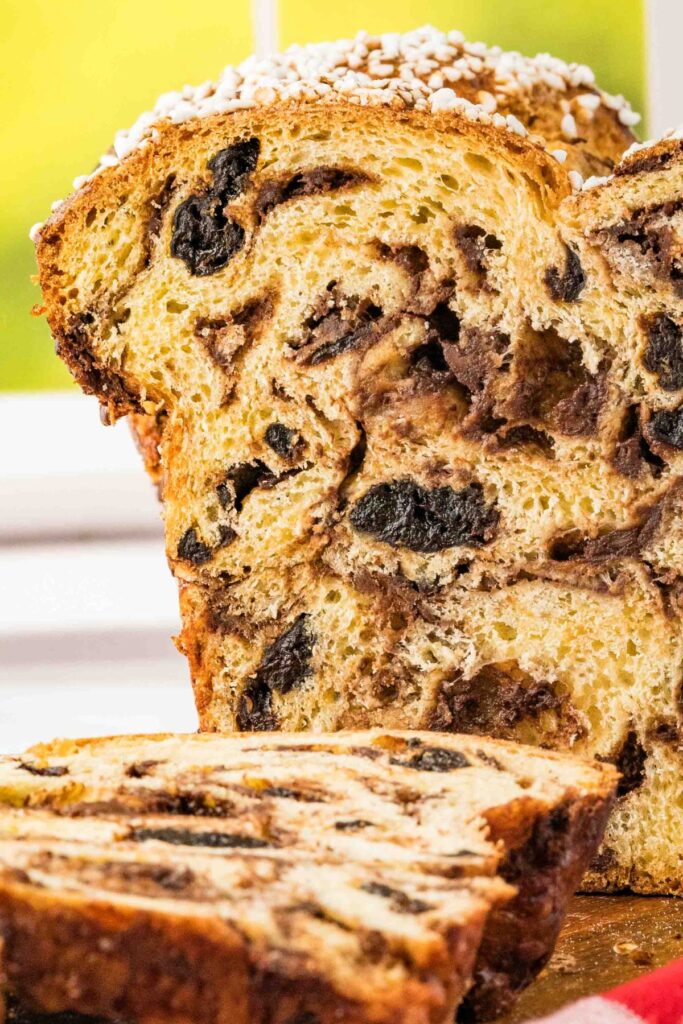 sliced loaf of bread with dried cherries and chocolate swirl.