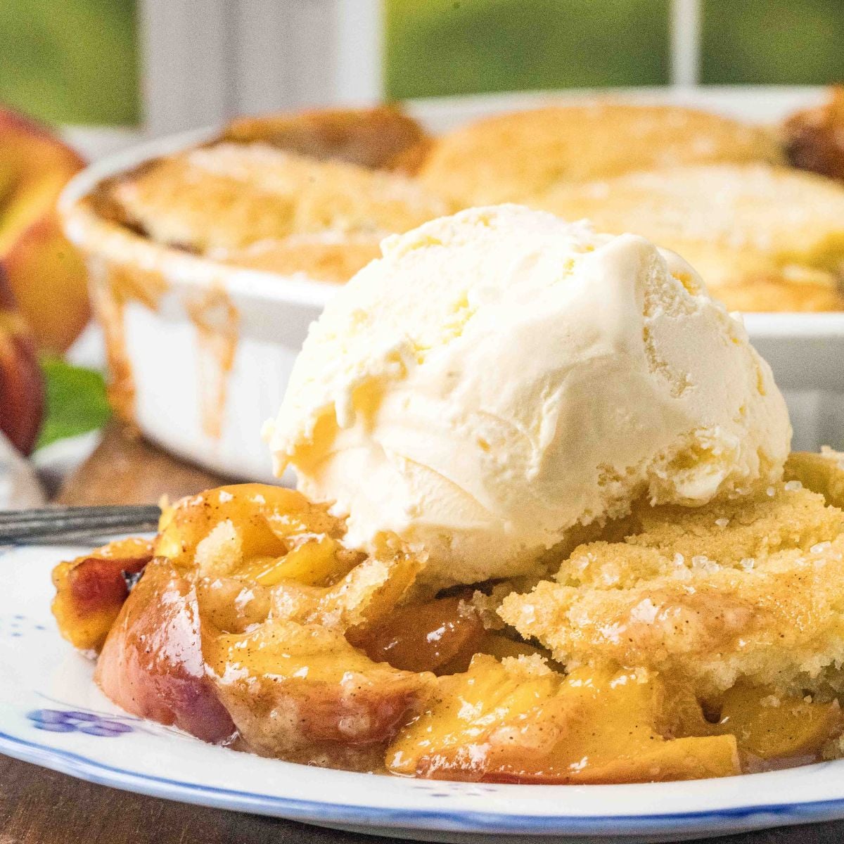 peach cobbler with ice cream on top.