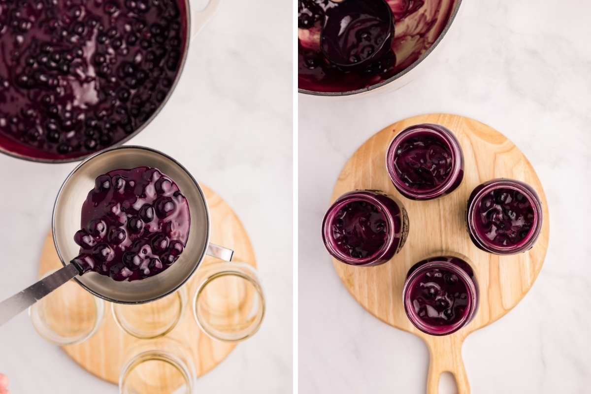 Ladle scooping blueberry pie filling into jars on a wooden board.