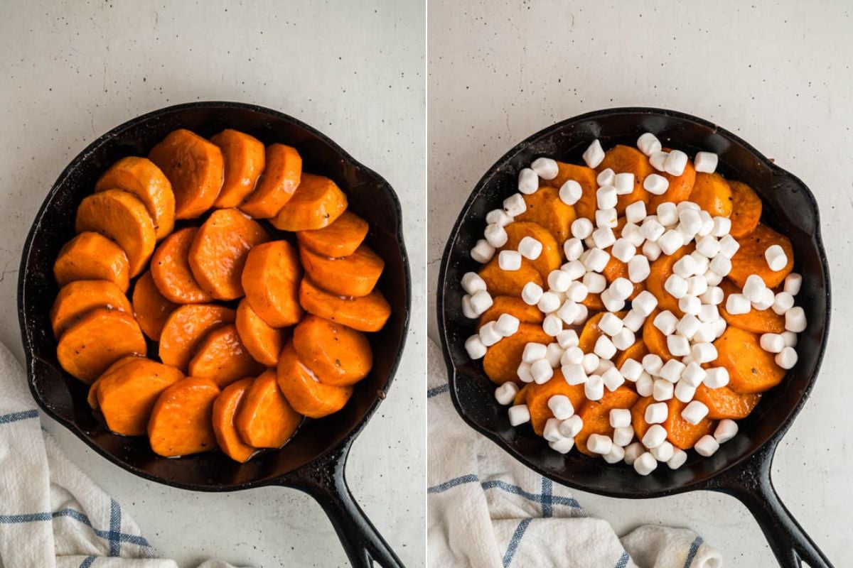 skillet with sweet potatoes with glaze and marshmallows on top.