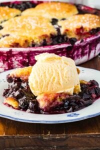 scoop of cobbler on blue and white plate.