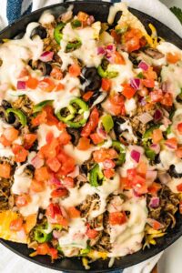 skillet of finished nachos.