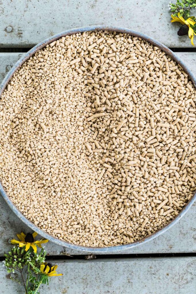 a metal dish showing half crumble deed half pellet feed