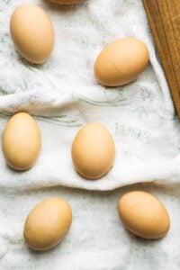 brown eggs on tea towel