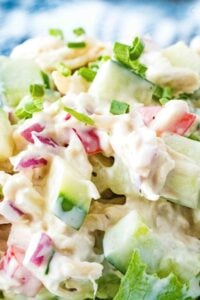 chicken salad with cucumbers on lettuce.
