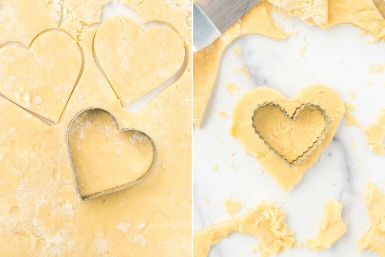 rolled out cookie dough being cut with heart cookie cutters.
