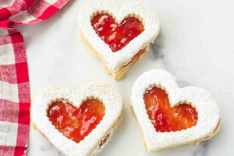 3 finished jam heart sandwich cookies.