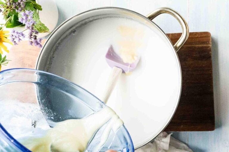 adding milk solution to melted soap base.