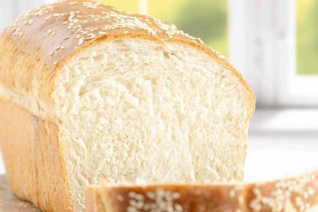 sliced white loaf with sesame seeds.