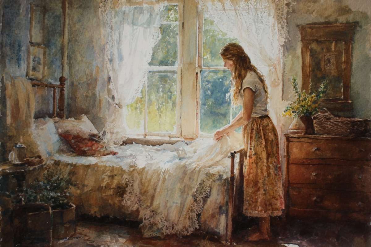 woman in sundress making bed.