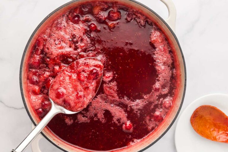 skimming foam off jam.