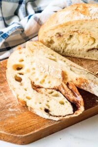 sliced loaf of round sourdough bread with cinnamon swirl.