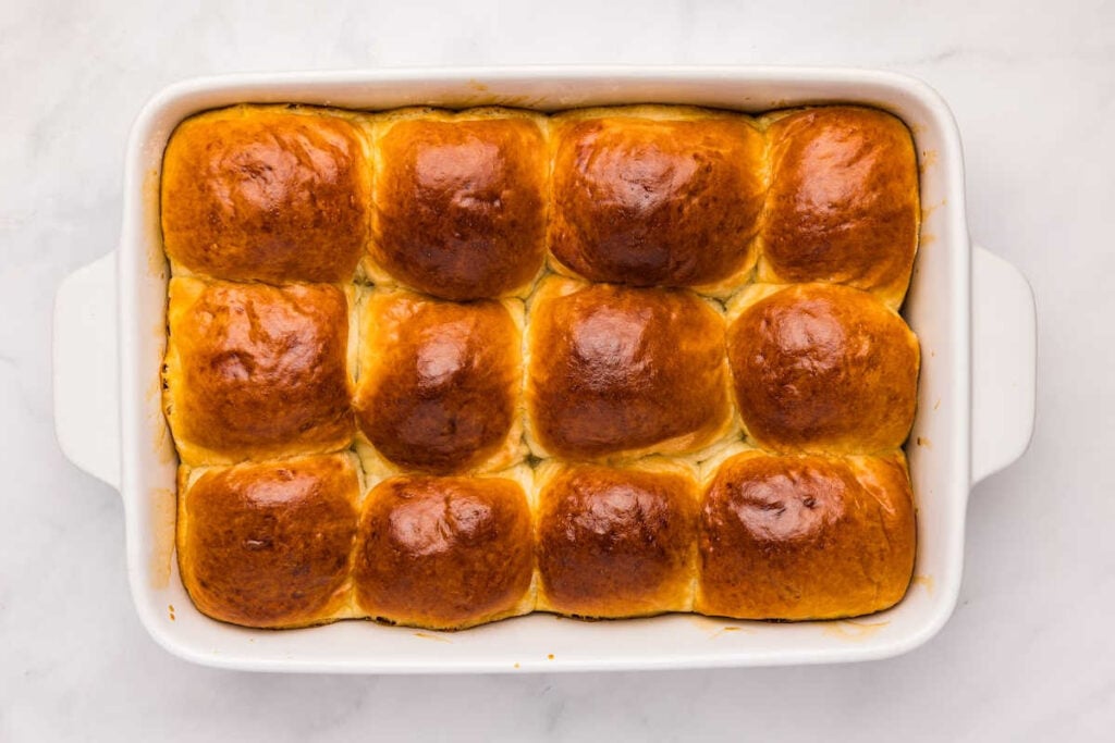 finished baked rolls in baking dish.