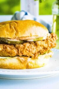 finished fried chicken sandwich with spicy sauce lettuce layer on top