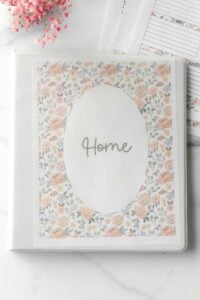 binder with free home printables in pink floral design.