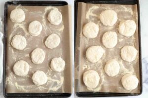 Two trays lined with parchment paper, each with rounds of uncooked sourdough English muffins dusted with flour, before and after the second rise.